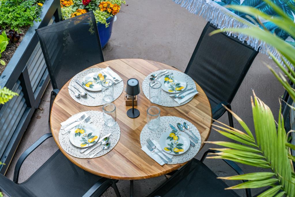 Round outdoor dining table set for four