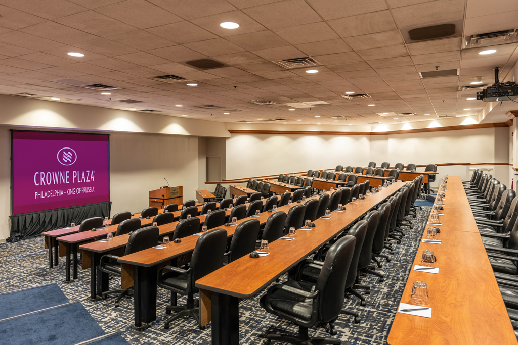 Hotel banquet hall with round tables set for an event