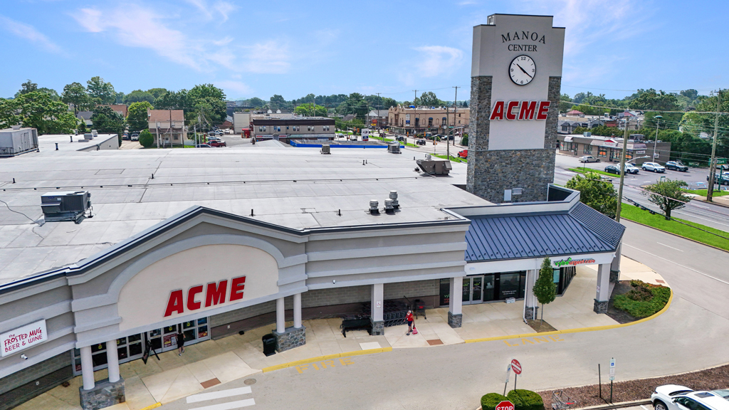 ACME grocery store with clock tower at shopping center
